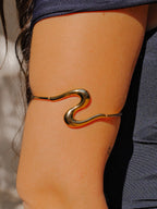Brazalete fino ola dorado