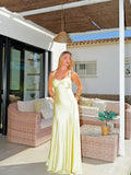 Vestido entrelazado escote concha amarillo