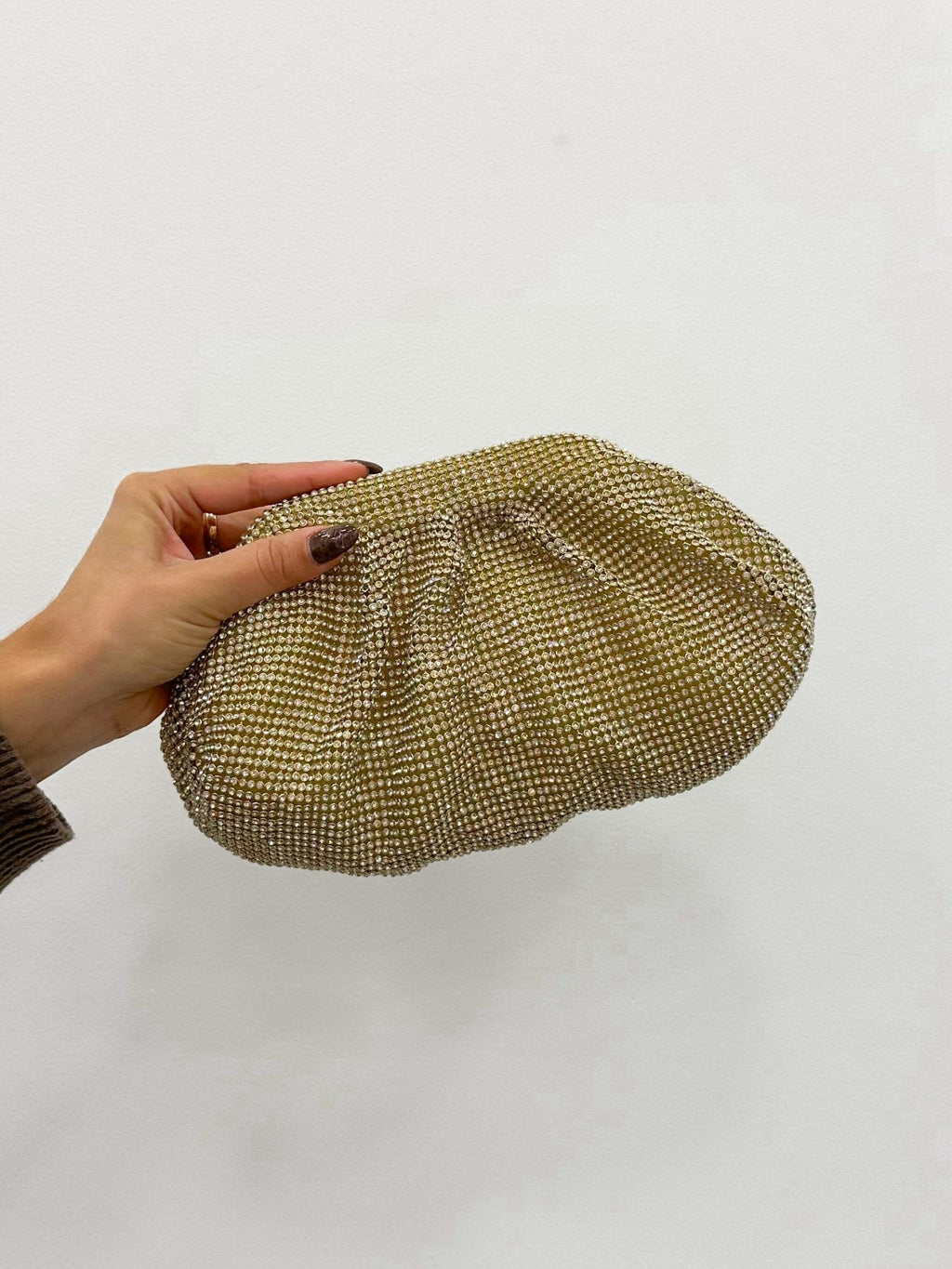Clutch bombonera brillos dorado