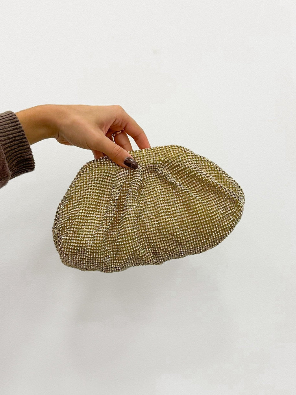 Clutch bombonera brillos dorado